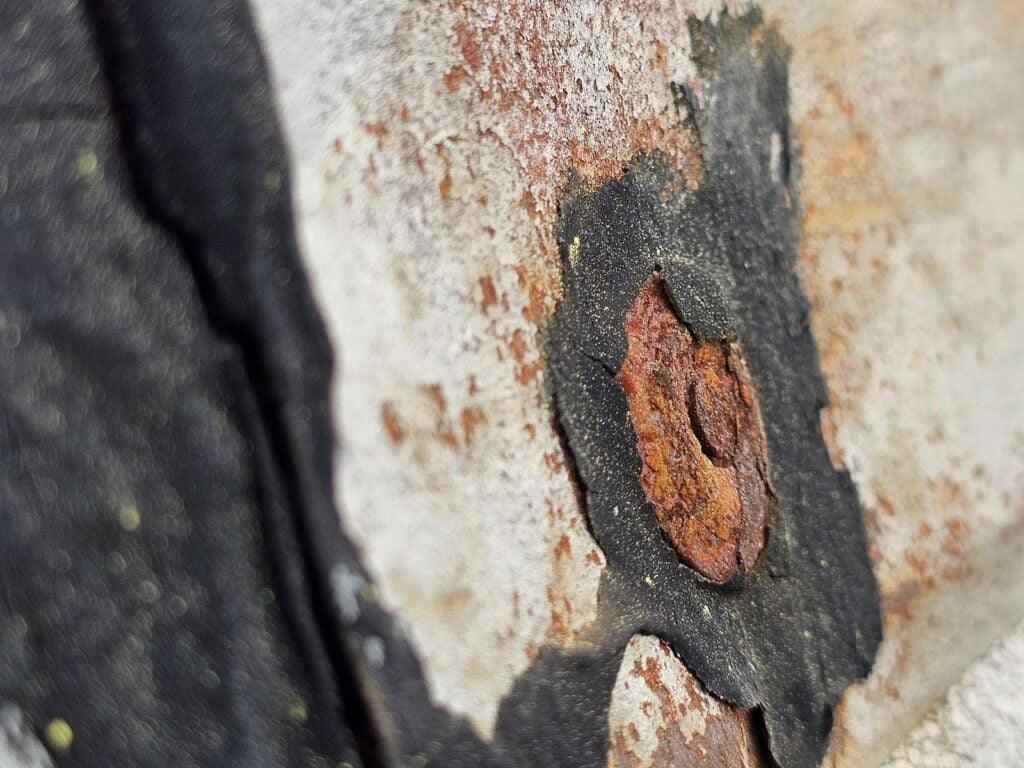 Roofing inspection showing cap nails at ridge line in Washington, DC