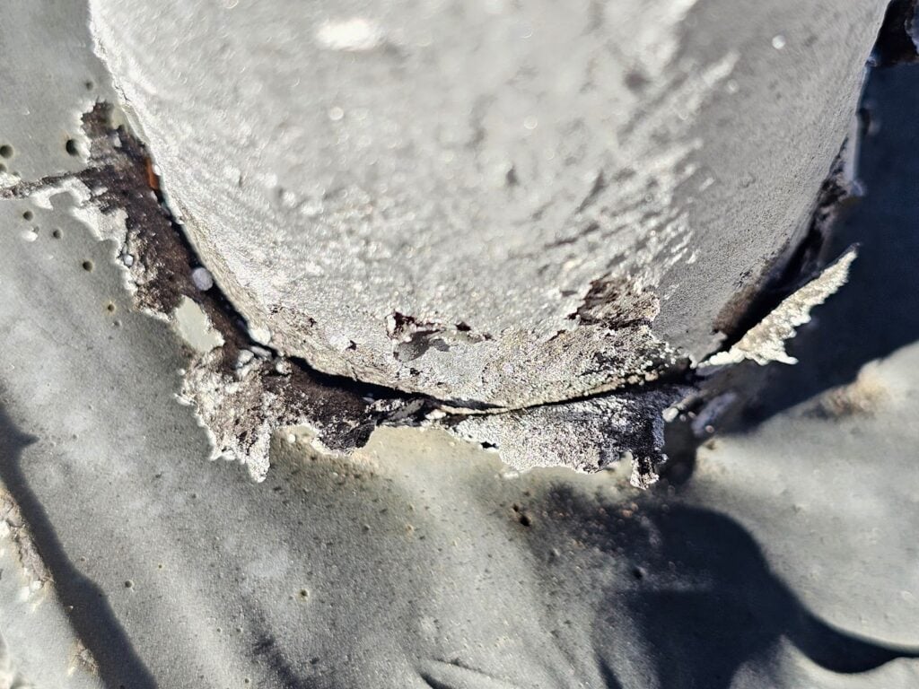 Water damage from failing roof pitch around mechanical penetration in Washington, DC