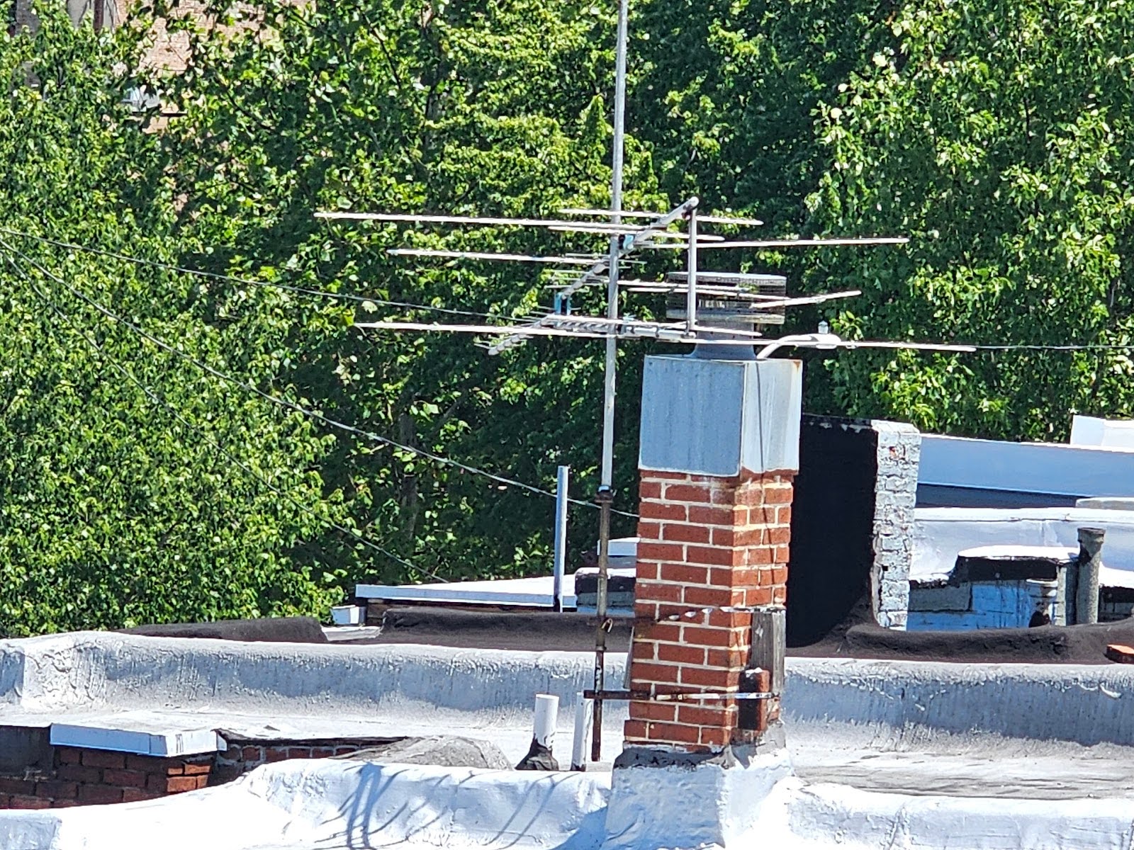 Rooftop removal of old antenna and satellite dishes Washington DC