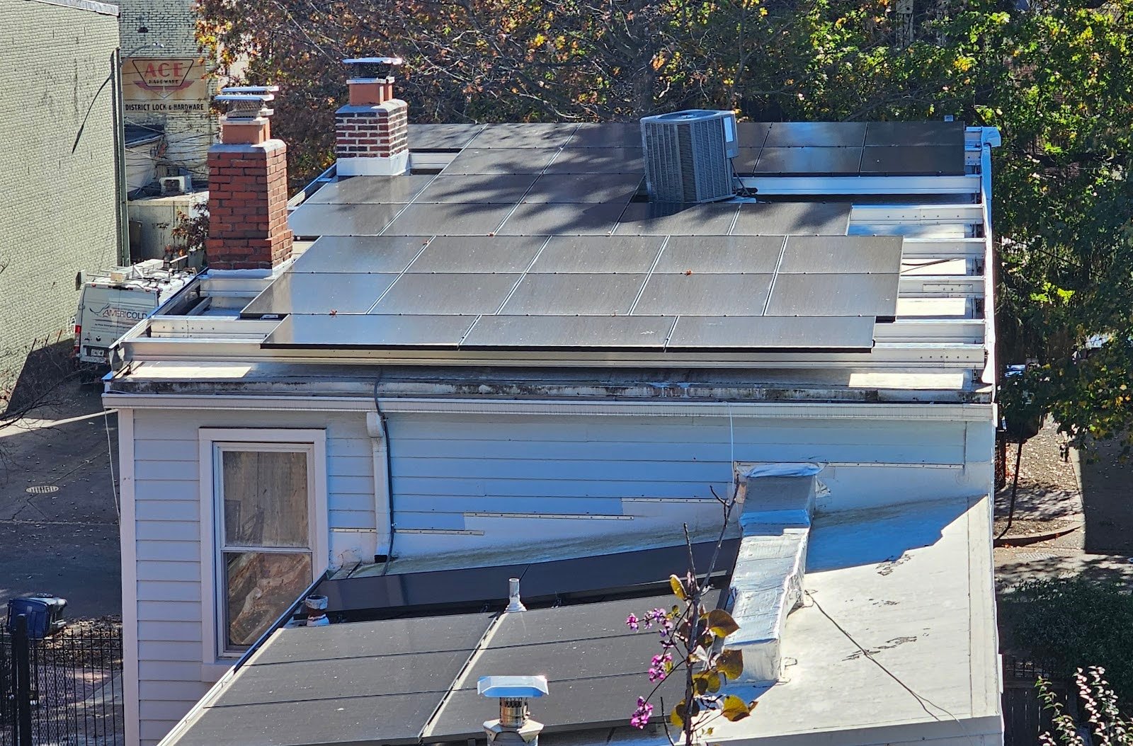 Residential flat roof repair in Logan Circle DC with scupper drain clearing