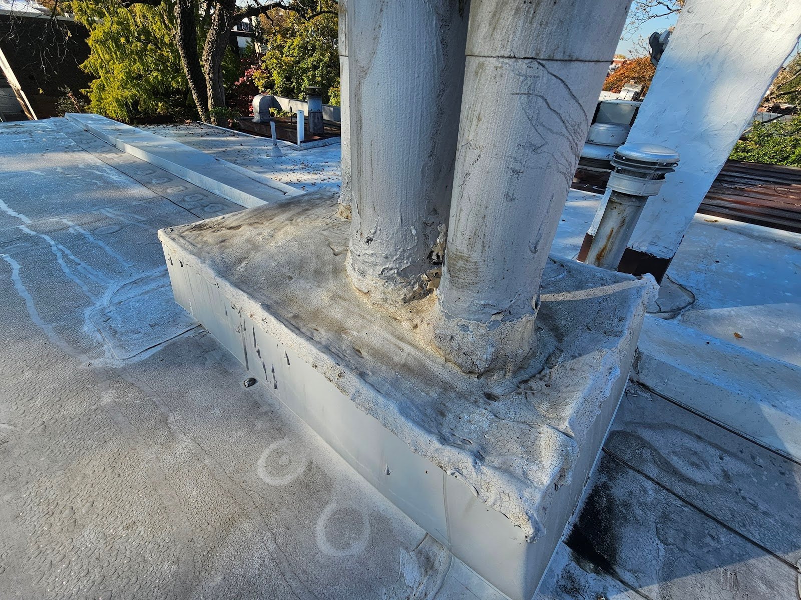 Modern pitch pocket installation on commercial flat roof