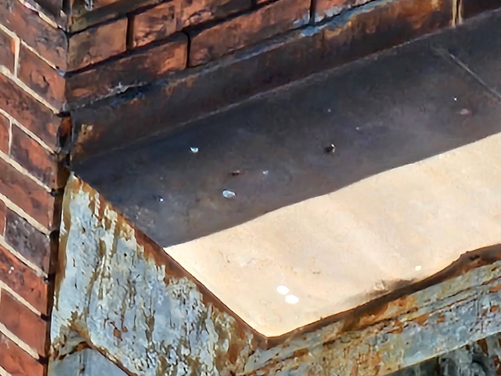 Close-up of masonry cornice with water table detail