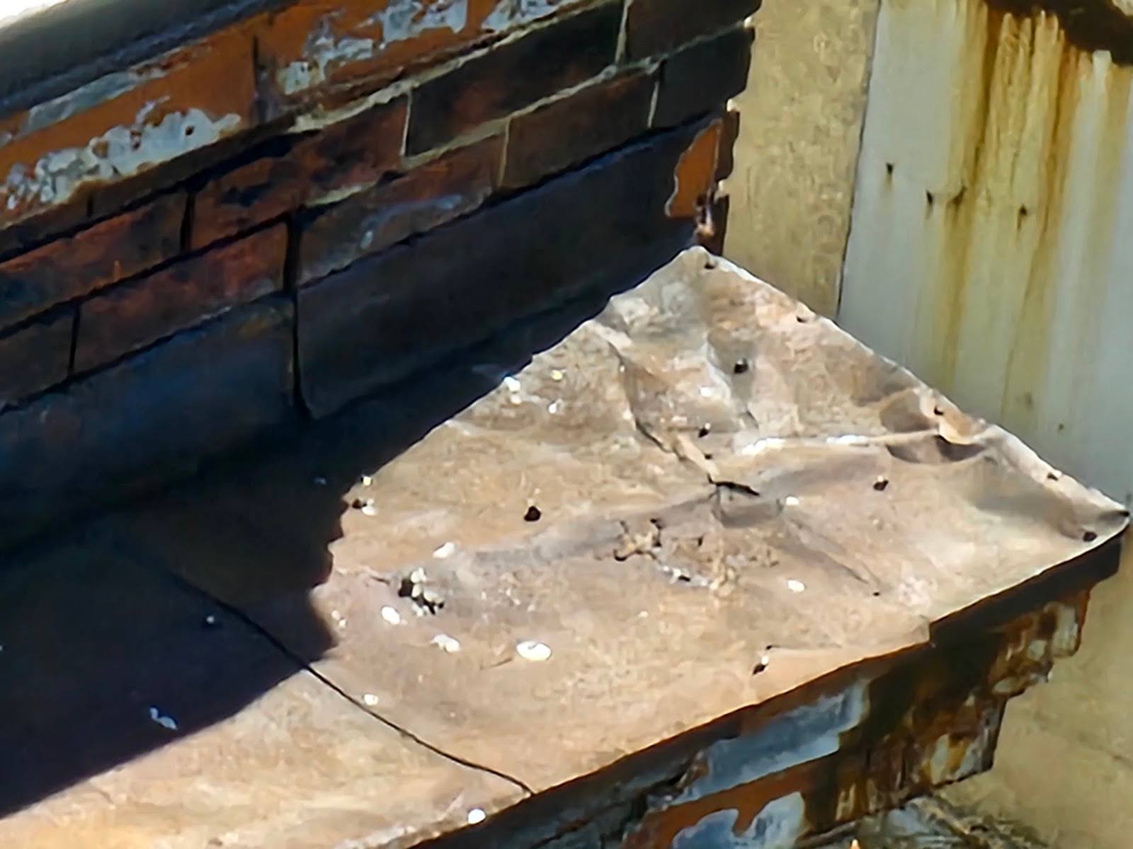 Damaged cornice caused by improper water table placement