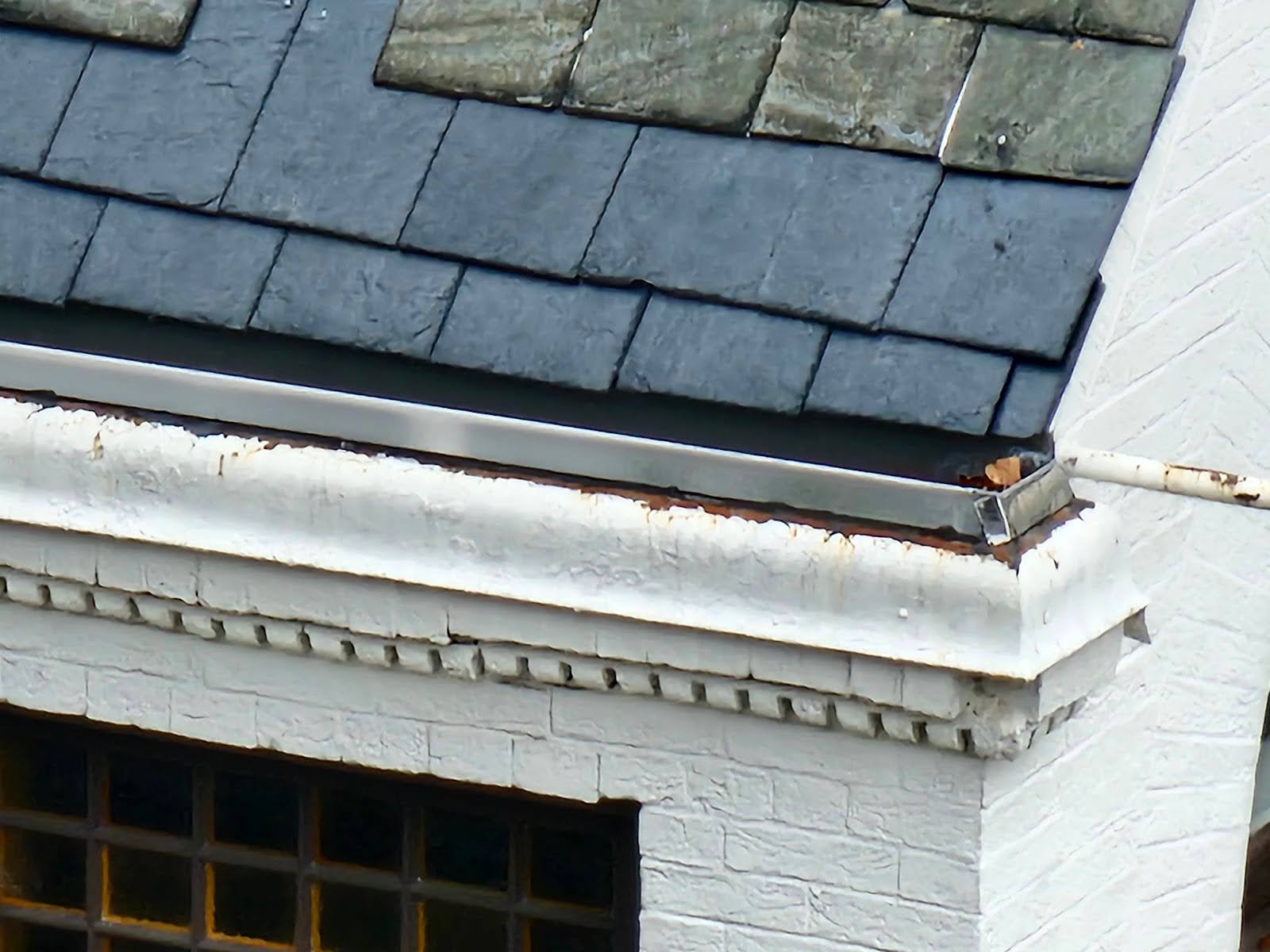 Mixed roofing materials and shapes on a multi-style building