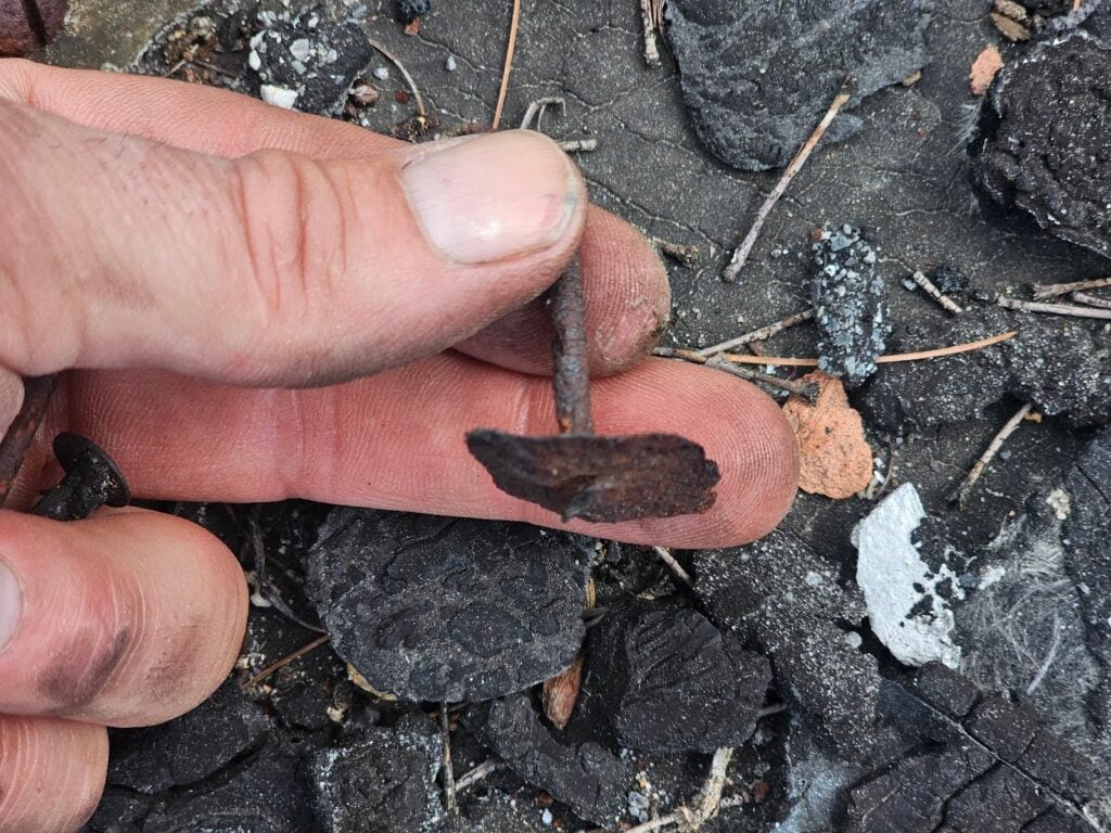 thick black asphalt tar crumbs left behind scattered