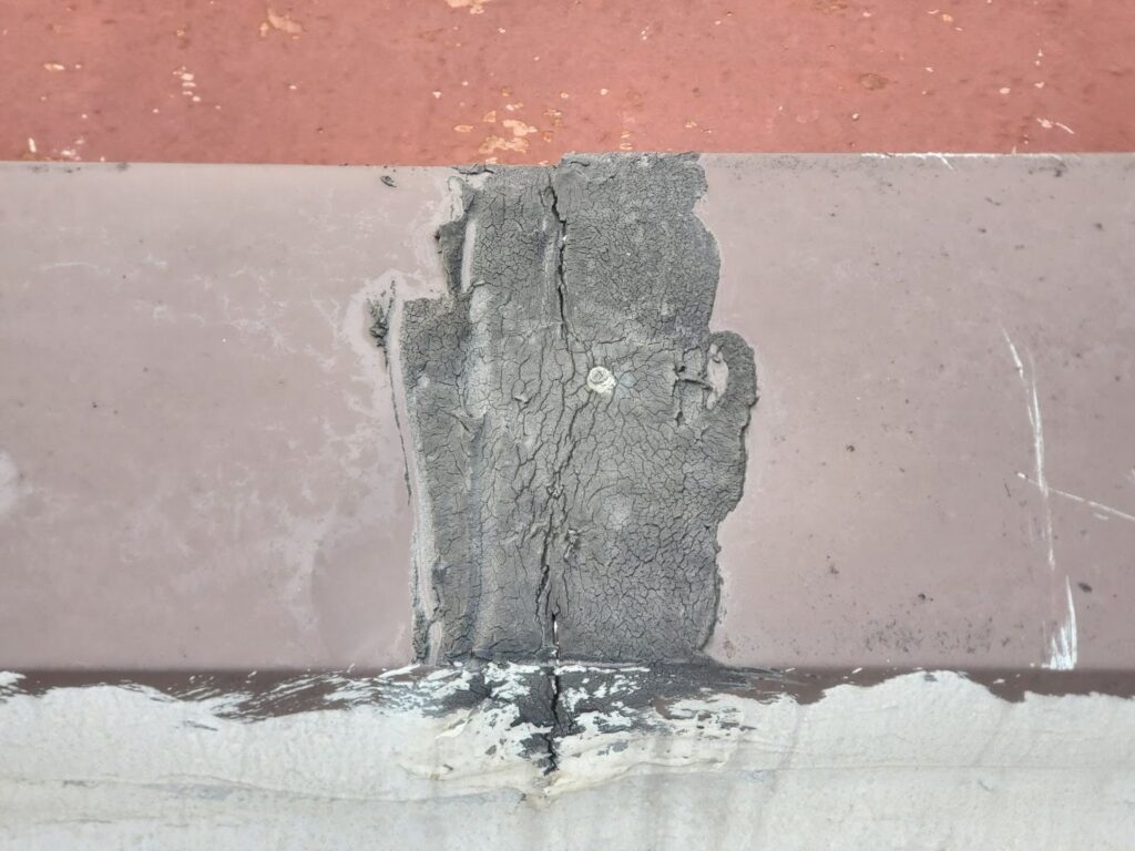 Close-up of properly installed metal parapet coping preventing water infiltration