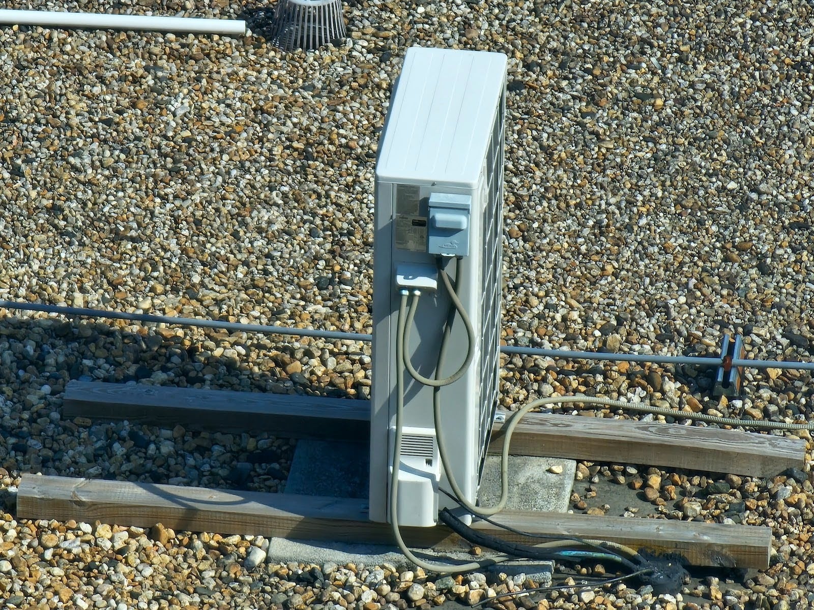 Example of a Ballasted Flat Roof - Part II 3 Protective gravel ballast installed over flat roof membrane system