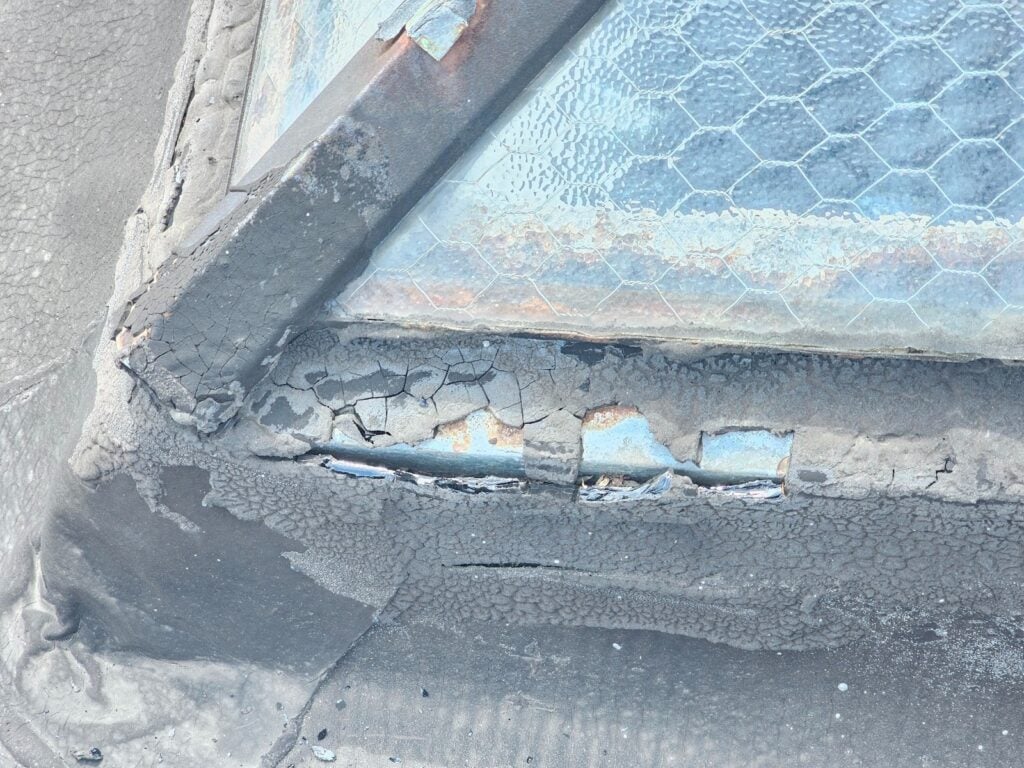 Damaged skylight area showing signs of water leakage