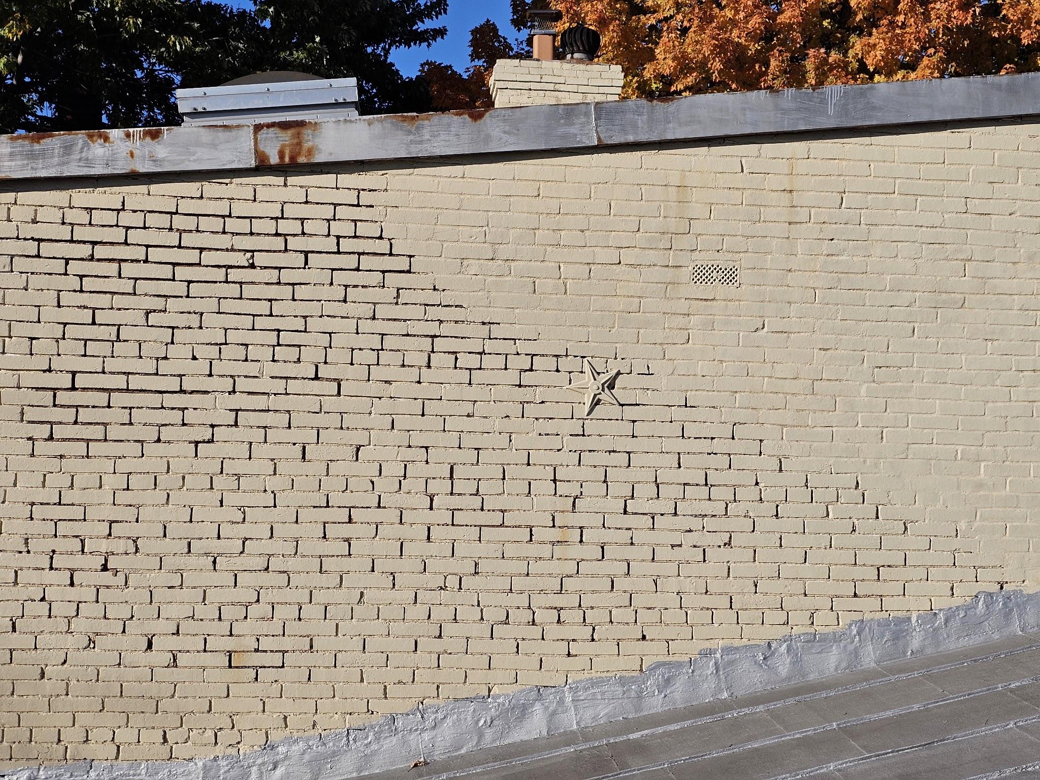 Ferrous metal coping at the parapet edge of a historic building in Washington DC