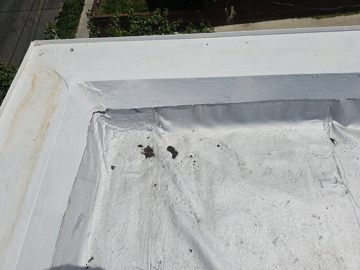 Nail Pop Through a Modbit Roof 2 Modbit membrane separation and ponding at parapet corner, Washington DC