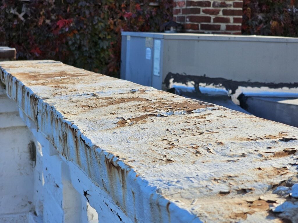 Ornate decorative ferrous metal coping on a historic Washington DC building being assessed for restoration